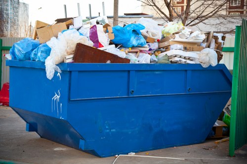 Rubbish collection team handling bulky items with care