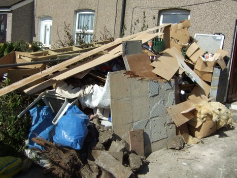 Professional team handling bed disposal from a central London flat